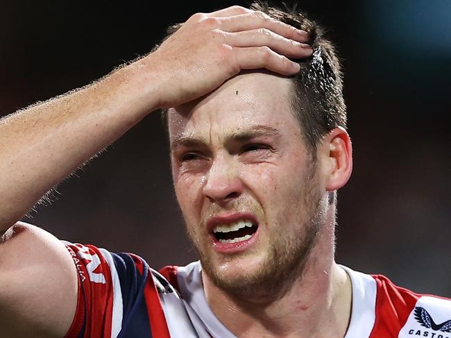 SYDNEY, AUSTRALIA - JUNE 11: Luke Keary of the Roosters holds his head as he leaves the field for an Head Injury Assessment  during the round 14 NRL match between the Sydney Roosters and the Melbourne Storm at Sydney Cricket Ground, on June 11, 2022, in Sydney, Australia. (Photo by Mark Kolbe/Getty Images)