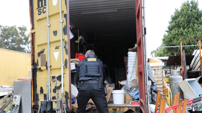 Investigators from the multi-agency task force at a Broadford property. Picture: David Hurley