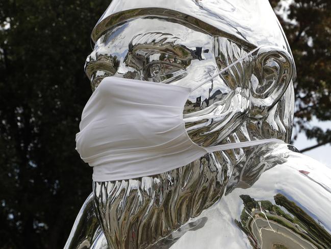 A statue outside a restaurant wears a mask in central Christchurch, New Zealand. Picture: AP