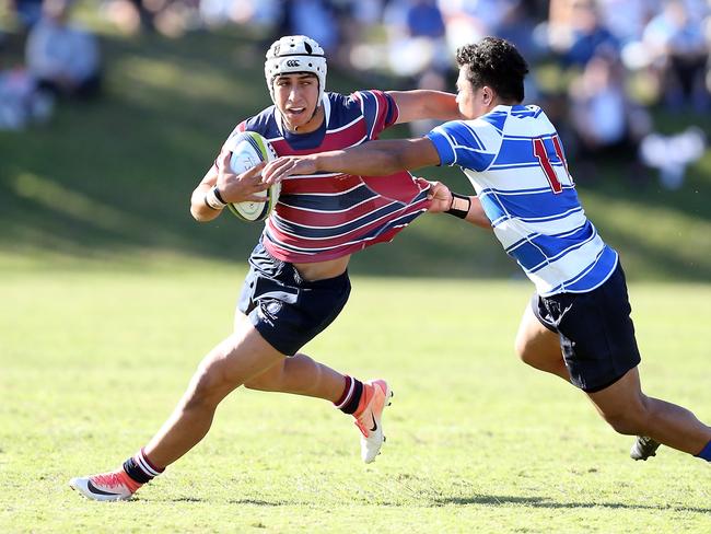 Action pics of the 2019 Round 1 GPS Rugby blockbuster between The Southport School and Nudgee College at TSS. Photo of Dion Samuela (TSS) and Robert Mapa. Photo by Richard Gosling