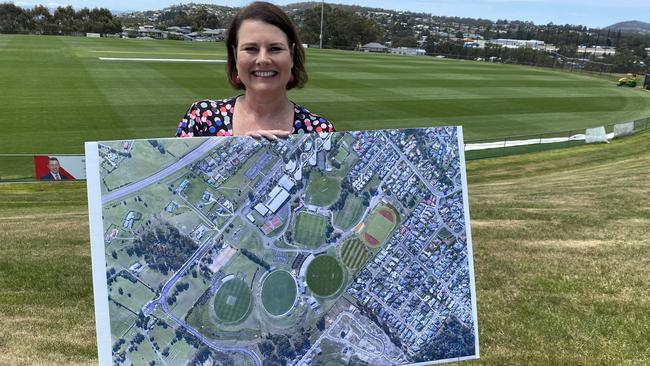 Kingborough Mayor Paula Wriedt with an aerial view of an expanded Twi Ovals precinct to accommodate an AFL High Performance Centre. Picture: James Bresnehan.