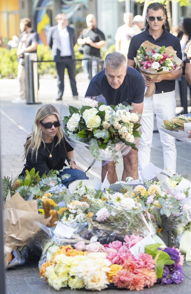 Family members lay flowers on the one-year anniversary of the Westfield Bondi stabbing that killed 6 people. Picture: NewsWire / Jeremy Piper