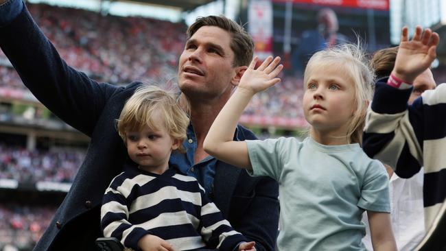 Tom Hawkins with his kids in the AFL Grand Final motorcade after his retirement. Picture Lachie Millard