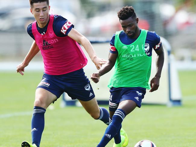 MELBOURNE, AUSTRALIA - FEBRUARY 19: Elvis Kamsoba (L) controls the ball during the Melbourne Victory Training Session at Gosch's Paddock on February 19, 2019 in Melbourne, Australia. (Photo by Michael Dodge/Getty Images)