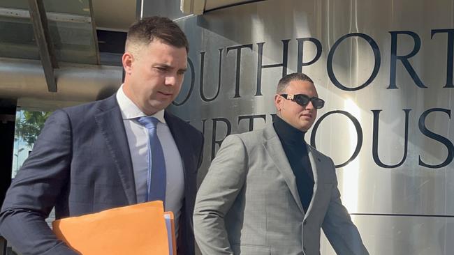 Ryan Dymond (right) leaving court with his lawyer. Picture: Jessica Paul