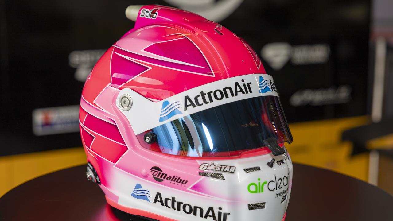 Limited-edition pink racing helmets which have been designed and painted by renowned helmet artist Trent Rogers. Picture: Supplied