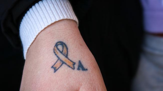 Launceston mother-of-four Maddy McKenna's tattoo of a golden ribbon in memory of her son Archie. Picture: Stephanie Dalton
