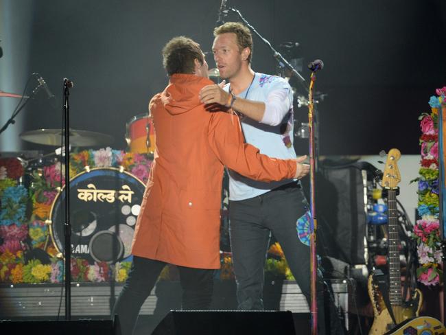 Liam Gallagher and Chris Martin perform on stage on June 4, 2017 in Manchester, England. Picture: Getty Images/Dave Hogan for One Love Manchester