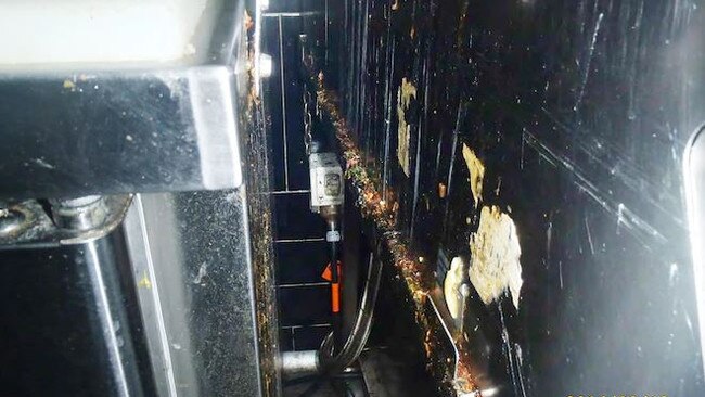 A picture taken by a council health inspector of hygiene failures and filthy equipment at Nando’s Restaurant at Belmont Forum Shopping Centre.