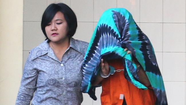 Sara Connor is escorted by police to hospital, where she underwent a physical examination. Picture: Lukman S. Bintoro.