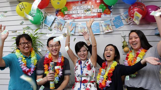 Andrew Nguyen, Danny Nguyen, Anne Huang, Anna Ton, Sarah Ngo from Mitchum News in Cabramatta celebrate after selling a winning division one ticket, 11 days after the store relocated.