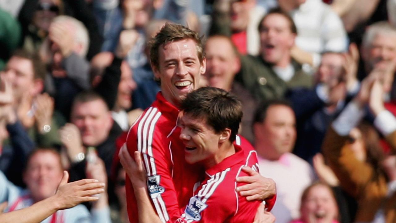 Peter Crouch of Liverpool celebrates scoring with Xabi Alonso