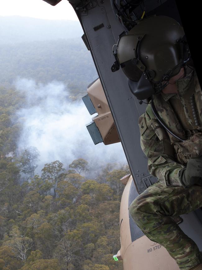 An Australian Army 5th Aviation Regiment loadmaster observes the area near Mount Ginini close to the New South Wales and Australian Capital Territory border.
