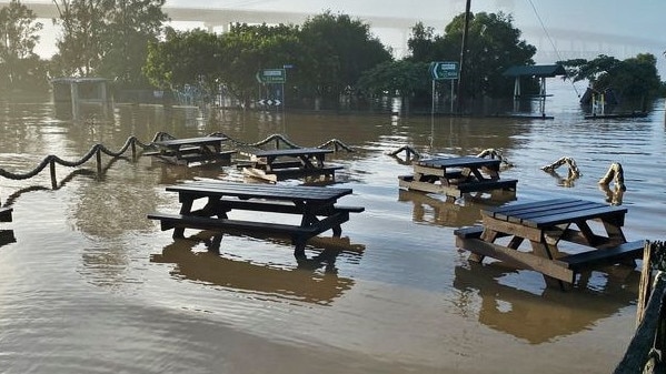 beer garden at the Harwood Hilton under water on Wednesday, 24th March, 2021 with the Harwood bridges shrouded in fog in the background.