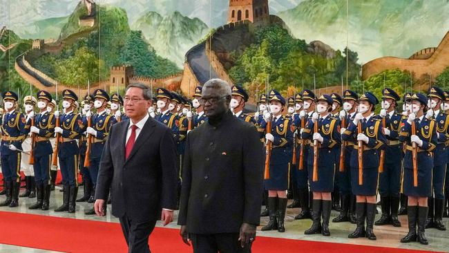 Then Solomon Islands' Prime Minister Manasseh Sogavare, right, and China's Premier Li Qiang inspect the guard of honour during a welcome ceremony at the Great Hall of the People in Beijing in 2023. Picture: Andy Wong/Pool/AFP