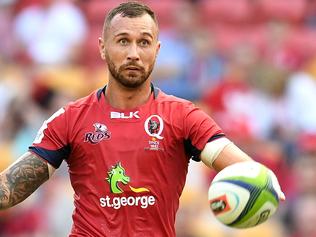 Quade Cooper of the Queensland Reds (right) kicks during their round 8 Super Rugby game against the Southern Kings at Suncorp Stadium in Brisbane, Saturday, April 15, 2017. (AAP Image/Dan Peled) NO ARCHIVING, EDITORIAL USE ONLY