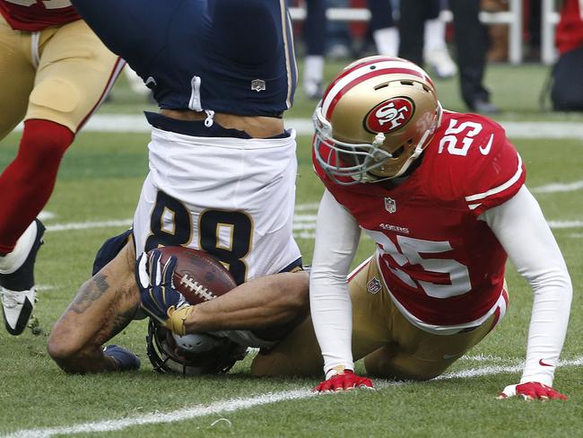 St. Louis Rams tight end Lance Kendricks (88) is tackled by San Francisco 49ers strong safety Jimmie Ward (25).