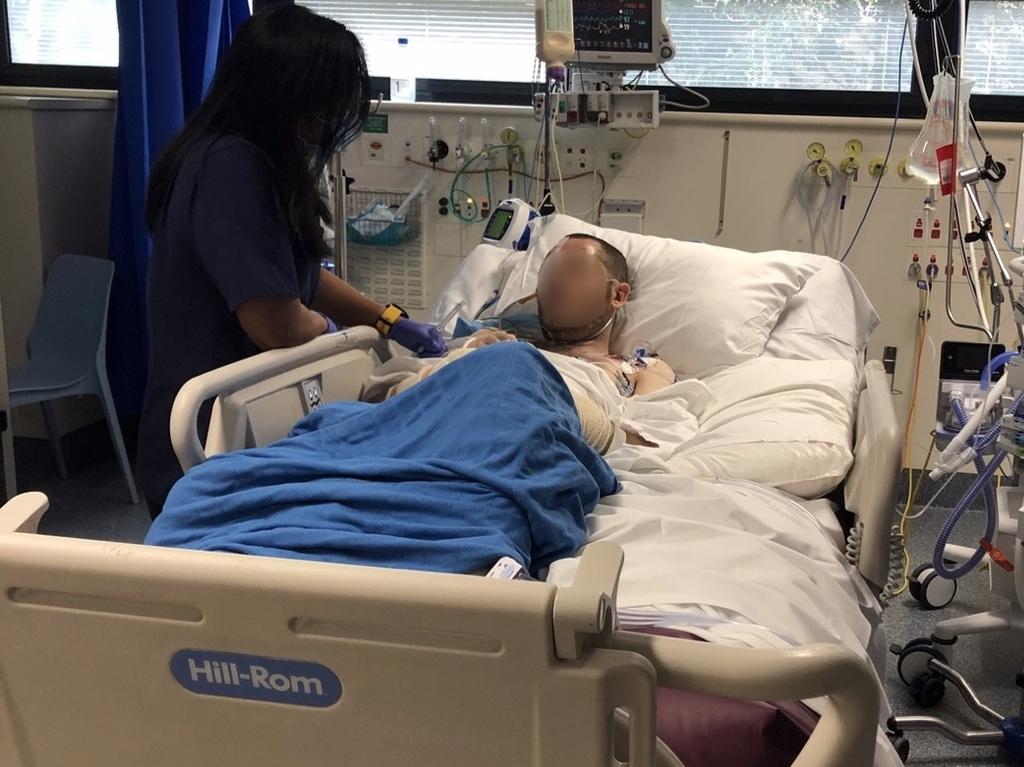 Mr Halcro being treated at Royal Prince Alfred, where he was put in a coma. Picture: Supplied