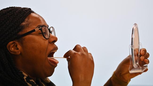 A woman takes a Covid-19 lateral flow test in London.