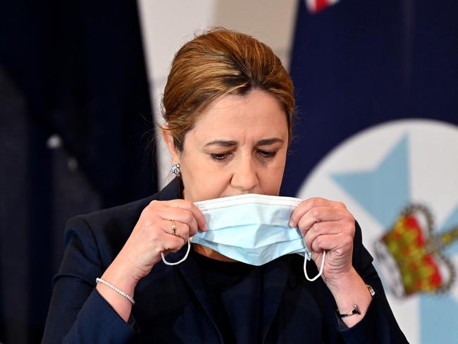 BRISBANE, AUSTRALIA - NewsWire Photos - FEBRUARY 7, 2022.Queensland Premier Annastacia Palaszczuk puts her mask on during a press conference to provide a Covid update.Picture: NCA NewsWire / Dan Peled