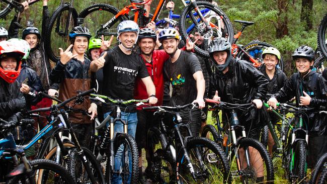 Member for Hornsby Matt Kean with Dan Smith from Synergy Trails and professional mountain biker Matt Jones. They stand alongside other mountain bikers at Hornsby Mountain Bike Trail in Hornsby. Picture: Jordan Shields