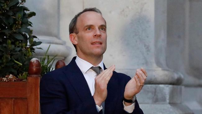 Britain’s Foreign Secretary Dominic Raab takes part in a national “clap for carers” to show thanks for the work of Britain’s National Health Service (NHS). Picture: AFP