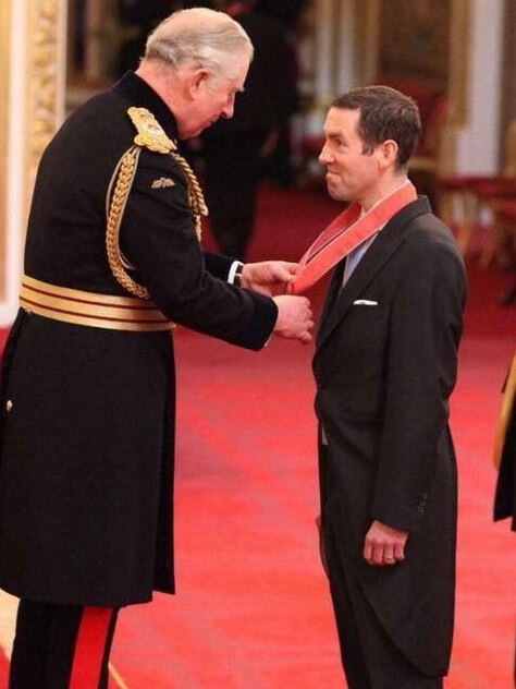 Lex Greensill accepts his award from Prince Charles.