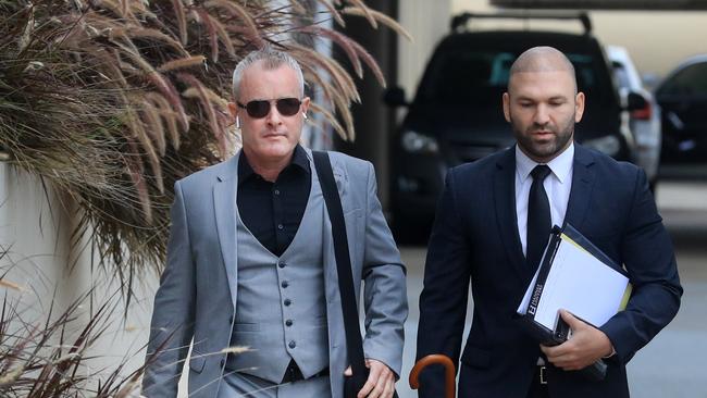 Jayden Moorea (left) arrives with his legal team for day 3 of the committal hearing at Southport Magistrates Court. Photo: Scott Powick.