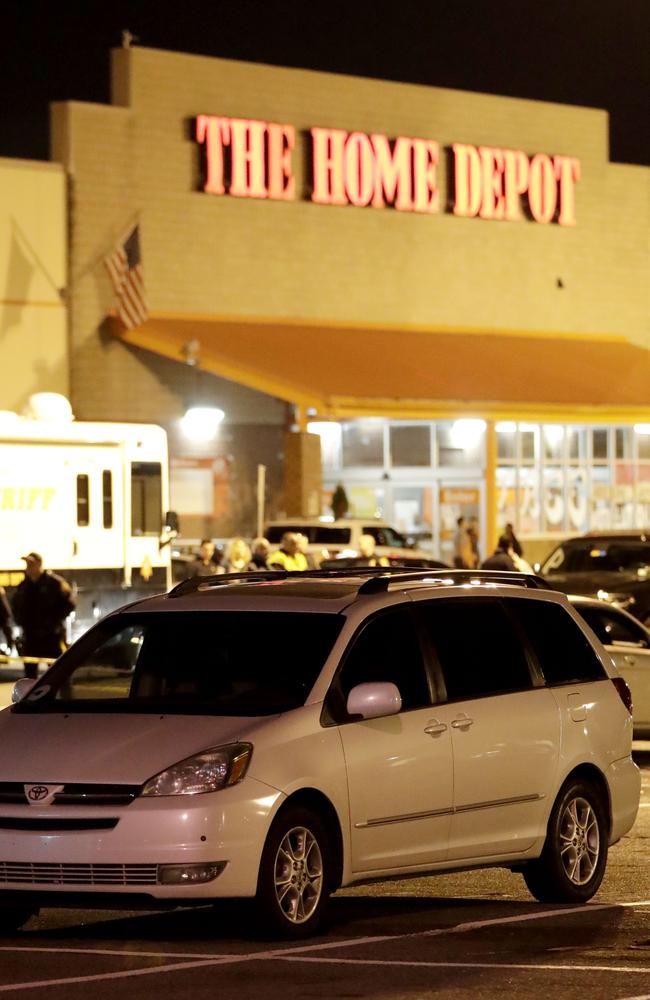 A vehicle is surrounded by a police perimeter in the parking lot of a Home Depot store. Picture: AP