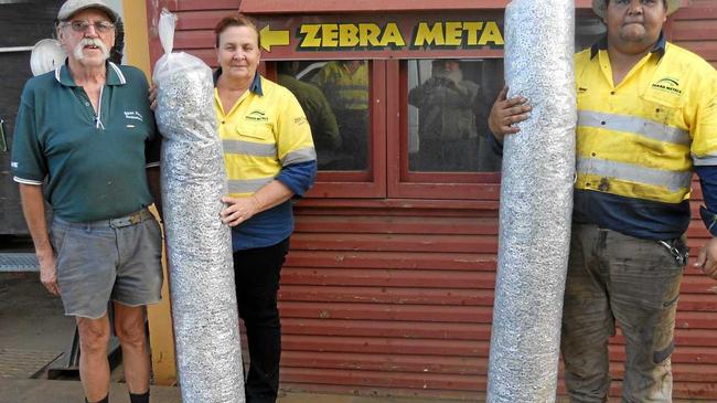 Sue and Blair from Zebra Metals receive kilos of ring-pulls collected by Gormans Removals. Picture: Jann Houley