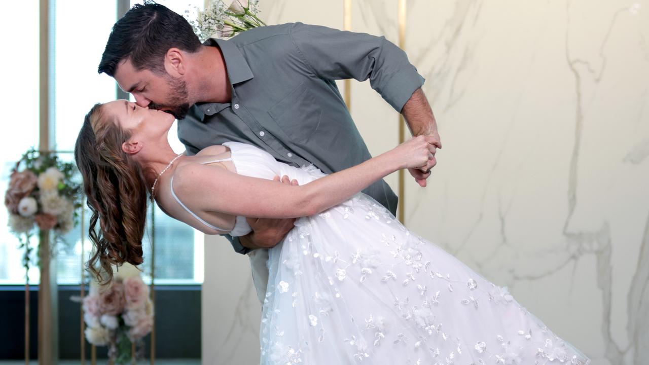 Emily Hill and Ryan Burton say their vows on Tuesday. Picture: Steve Pohlner