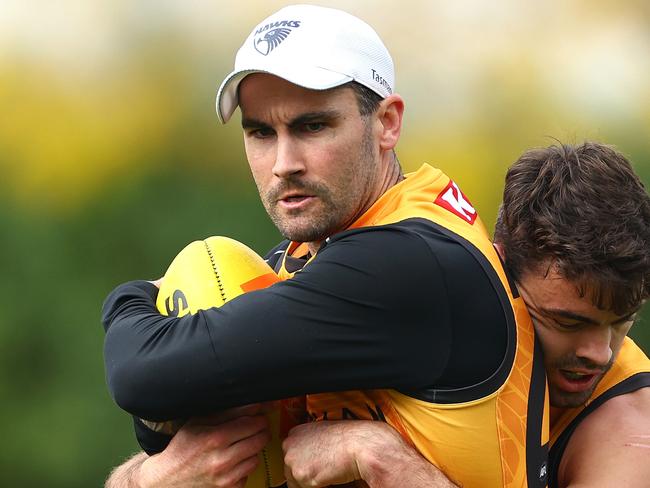 MELBOURNE, AUSTRALIA - APRIL 19: Chad Wingard of the Hawks is tackled by Conor Nash of the Hawks during a Hawthorn Hawks AFL training session at Waverley Park on April 19, 2024 in Melbourne, Australia. (Photo by Quinn Rooney/Getty Images)