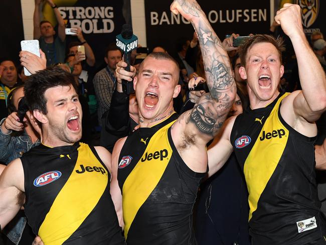 Trent Cotchin, Dustin Martin and Jack Riewoldt of the Tigers react after winning the second AFL preliminary final between the Richmond Tigers and the GWS Giants. Picture: AAP Image/Julian Smith