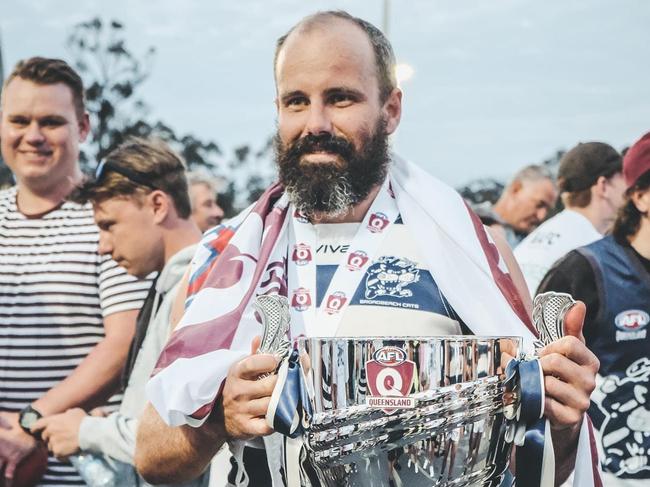 Broadbeach Cats senior QAFL player Josh Searl after the 2021 flag. Picture credit: Brooke Sleep Media