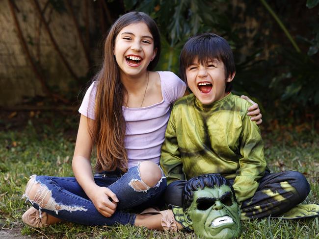 Luanda Perlstone Monroy, nine, with her brother Leon, six, who she painted for her winning Young Archies entry. Picture: Tim Hunter