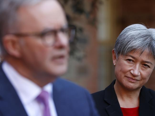 ADELAIDE, AUSTRALIA - MAY 20: Penny Wong listens to Labor Leader Anthony Albanese speak at a press conference during a visit to Cabra Dominican College on May 20, 2022 in Adelaide, Australia. The Australian federal election will be held on Saturday 21 May, 2022. (Photo by Lisa Maree Williams/Getty Images)