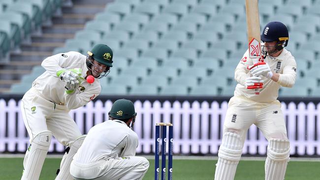 Tim Paine collects a ball during the four-day Ashes tour match at Adelaide Oval.