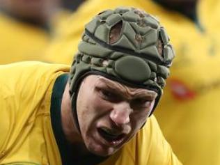 Australia's David Pocock (C) is tackled by Scott Malolua (R) of Samoa