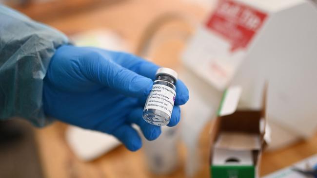 A health worker holds an empty vial of the AstraZeneca Covid-19 vaccine in Schwelm, Germany, on Wednesday. Picture: AFP