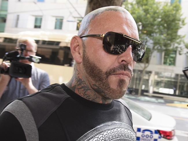 Ex-Bandido bikie Toby Mitchell arrives at the Melbourne Magistrates Court, in Melbourne, Wednesday, February 14, 2018. (AAP Image/Ellen Smith) NO ARCHIVING