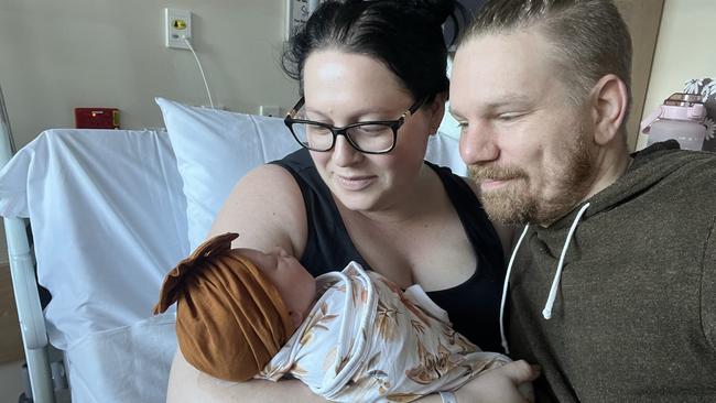 Rae Holfter with her husband Gavin and their youngest of three kids, Amali, the day after her birth. Picture: Supplied