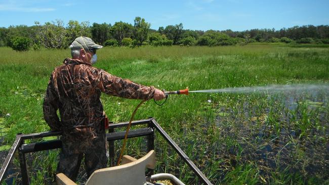 NT Field and Game member Bart Irwin participates in weed control at Harrison Dam. Picture: Supplied