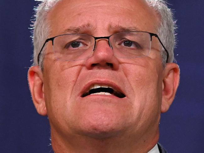 Australia's Prime Minister Scott Morrison speaks to the media to announce sanctions on top Russian officials following the invasion of eastern Ukraine, during a press conference in Sydney on February 23, 2022. (Photo by Steven SAPHORE / AFP)