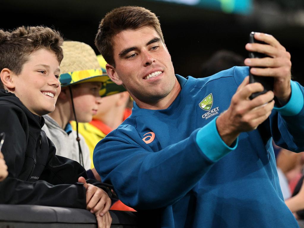 Australia's Xavier Bartlett poses for a selife with fans during the one-day international at the MCG. Picture: AFP