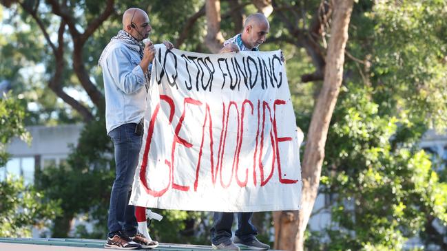 Pro Palestine protesters on the roof of building 72, UQ campus, St. Lucia on May 20. Picture: Liam Kidston