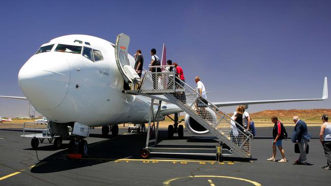 Passengers board a Qantas 737 at Mount Isa Airport.