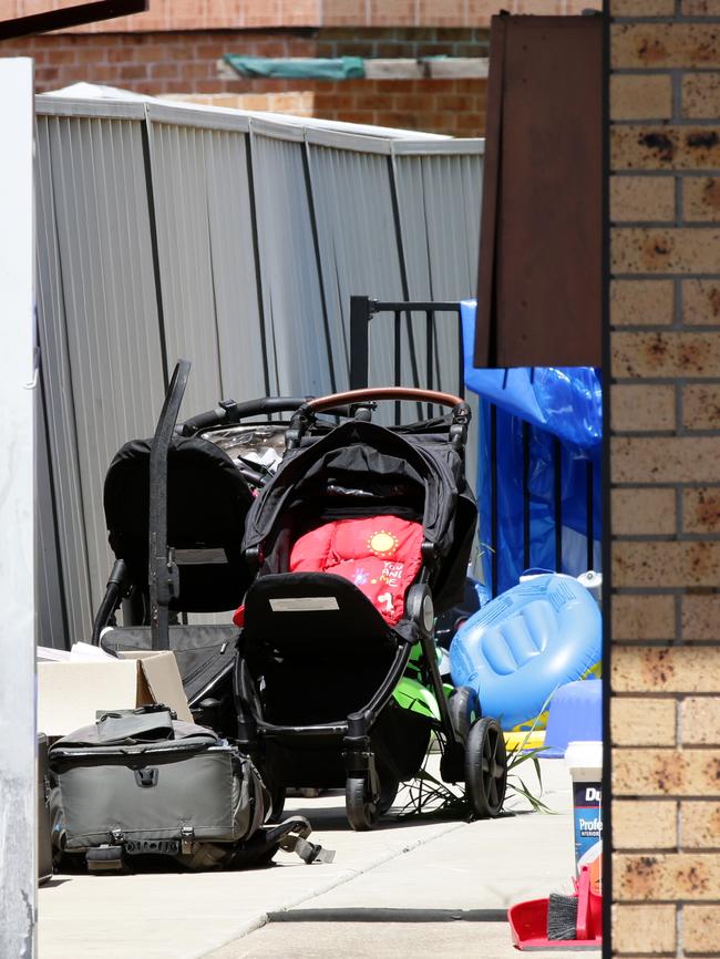 Toys and prams visible at the drug house