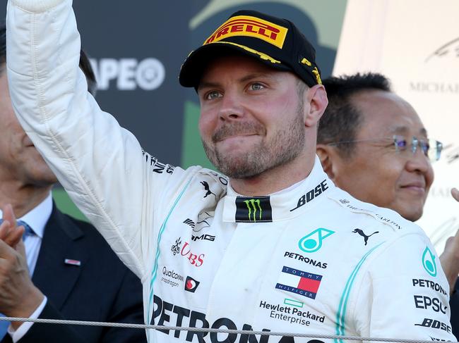 SUZUKA, JAPAN - OCTOBER 13: Race winner Valtteri Bottas of Finland and Mercedes GP celebrates on the podium during the F1 Grand Prix of Japan at Suzuka Circuit on October 13, 2019 in Suzuka, Japan. (Photo by Charles Coates/Getty Images)