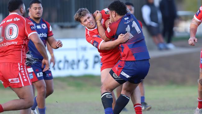 Tristyn Ball wraps up Collegians’ Samuel Kimi Ioane. Picture: Steve Montgomery