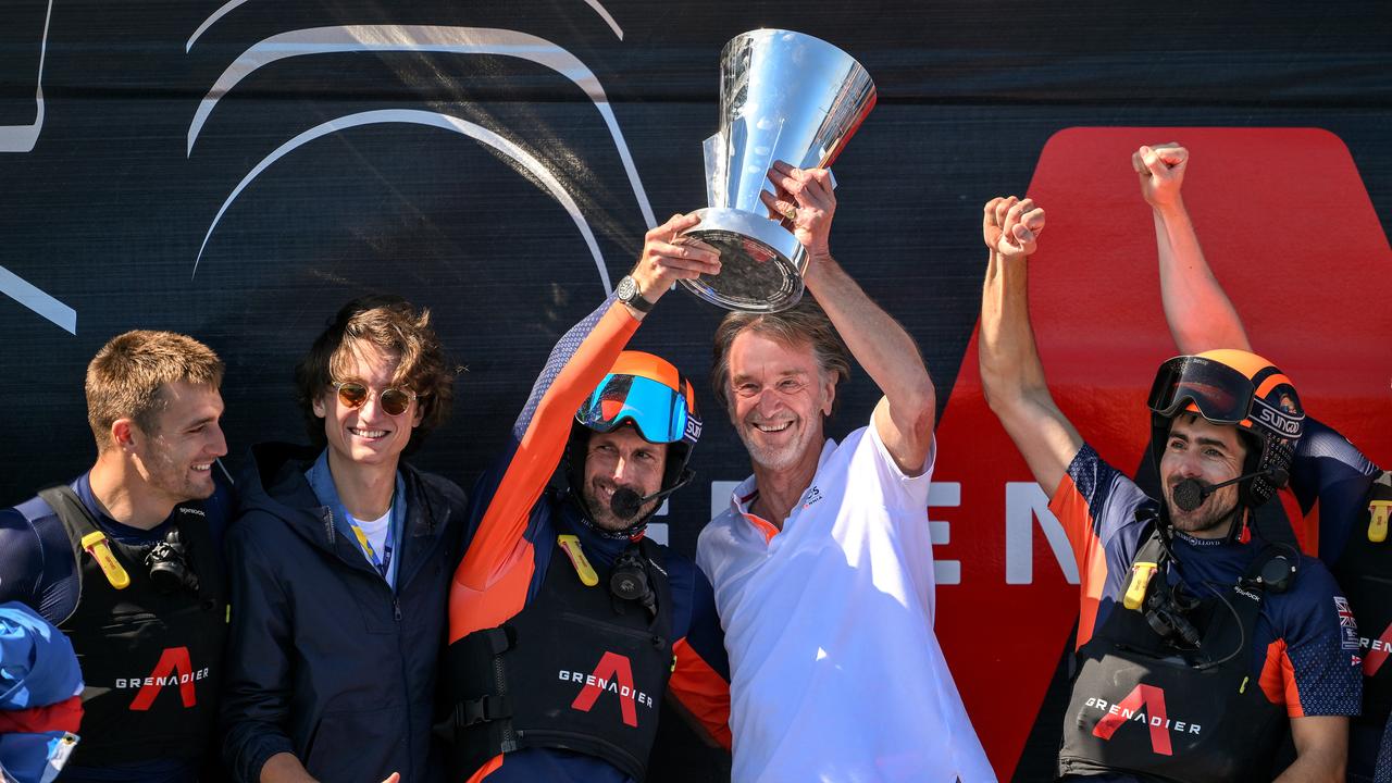 BARCELONA, SPAIN - OCTOBER 04: Sir Ben Ainslie skipper of the AC75 Ineos Britannia and Ineos CEO Sir Jim Ratcliffe celebrate with the Louis Vuitton Cup after defeating The AC75 Luna Rossa Prada Pirelli Team during the race 11 of the Louis Vuitton Cup Final - 37th America's Cup on October 04, 2024 in Barcelona, Spain. (Photo by David Ramos/Getty Images)